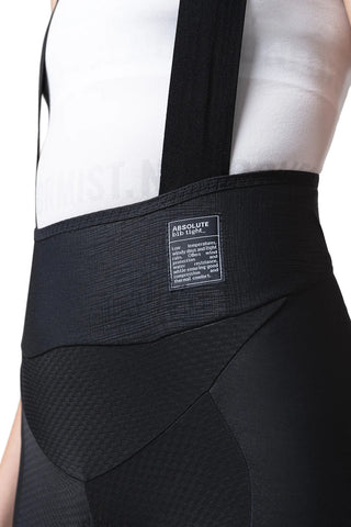 Dettaglio tessuto tecnico e fascia in vita dei pantaloni ciclismo lunghi Absolute 7.0 Women con bretelle, compressione graduata e comfort termico.