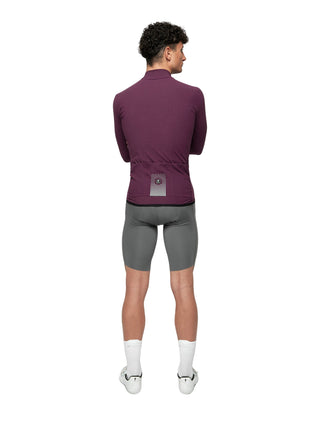 Retro maglia Pissei PrimaPelle bordeaux con tasche posteriori e dettagli riflettenti, design aerodinamico per ciclisti professionisti.