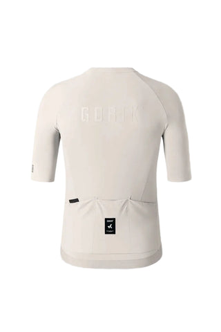 Retro completo della maglia da ciclismo Gobik CX Solid Argonite avorio con tasche posteriori e logo embossato.