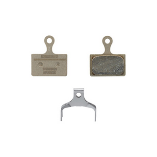 Pastiglie freno Shimano K05Ti-RX in resina con piastra in titanio e molla inclusa per freni a disco a 2 pistoni.