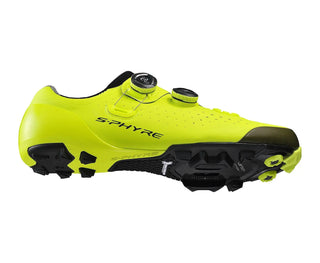 Vista laterale sinistra delle scarpe da ciclismo Shimano S-Phyre XC9 in giallo fluo, con suola Michelin nera e inserti in carbonio, ideale per gare cross-country ad alte prestazioni.